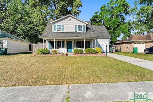 view of front facade featuring a garage, fence, a front yard, a porch, and driveway