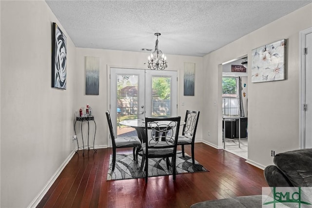 156 Laurel Green Ct, Savannah, GA 31419 - dining room with a chandelier, hardwood / wood-style floors, a textured ceiling, and baseboards