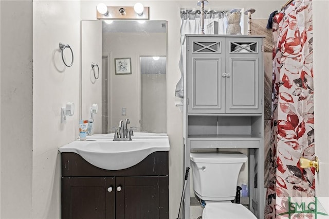 full bathroom with vanity and toilet