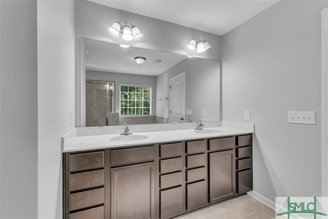 95 Wando View Way, Richmond Hill, GA 31324 - full bathroom featuring a sink, tile patterned flooring, double vanity, baseboards, and a shower with door