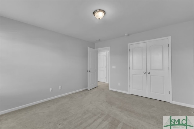 95 Wando View Way, Richmond Hill, GA 31324 - unfurnished bedroom with baseboards, carpet floors, and a closet
