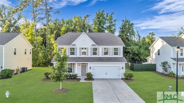 95 Wando View Way, Richmond Hill, GA 31324 - traditional-style home with driveway, roof with shingles, a front yard, a garage, and fence