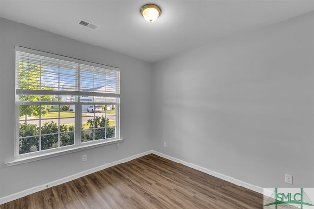 95 Wando View Way, Richmond Hill, GA 31324 - empty room featuring dark wood-style flooring, baseboards, and visible vents