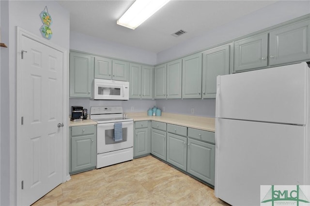 777 King George Blvd Unit 57, Savannah, GA 31419 - kitchen with white appliances, light countertops, and gray cabinetry