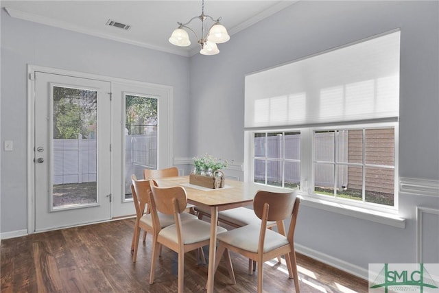 777 King George Blvd Unit 57, Savannah, GA 31419 - dining room with a chandelier, crown molding, dark wood-type flooring, and baseboards
