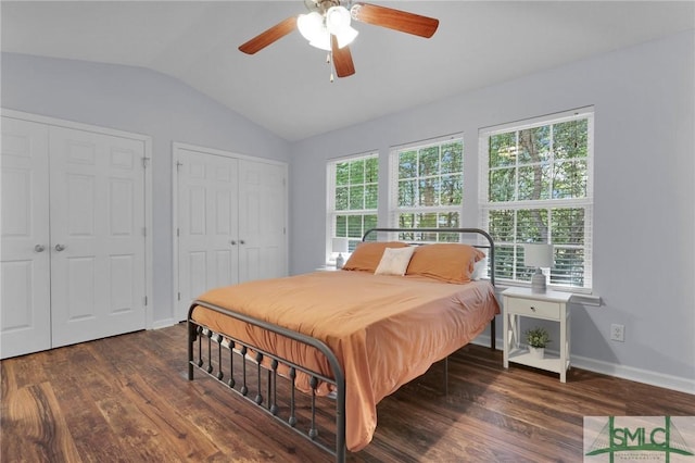 777 King George Blvd Unit 57, Savannah, GA 31419 - bedroom featuring two closets, lofted ceiling, wood finished floors, baseboards, and a ceiling fan