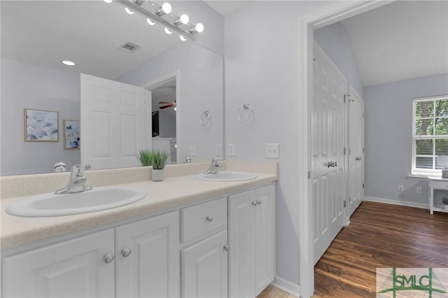 777 King George Blvd Unit 57, Savannah, GA 31419 - full bath with double vanity, wood finished floors, baseboards, and lofted ceiling