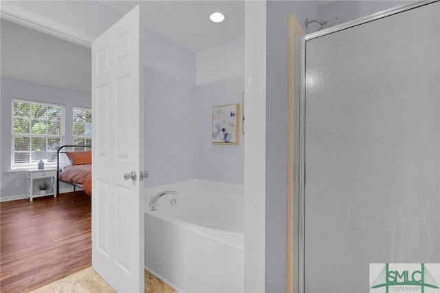 777 King George Blvd Unit 57, Savannah, GA 31419 - full bathroom featuring a garden tub, a shower stall, and connected bathroom