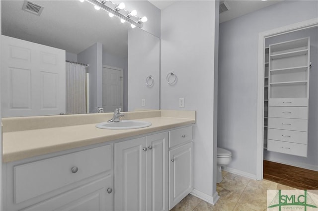 777 King George Blvd Unit 57, Savannah, GA 31419 - bathroom with toilet, vanity, and a closet