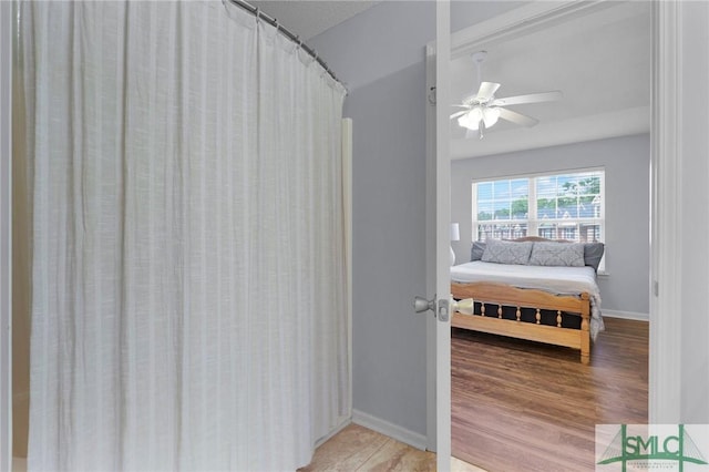 777 King George Blvd Unit 57, Savannah, GA 31419 - bedroom with light wood-type flooring, baseboards, and a ceiling fan