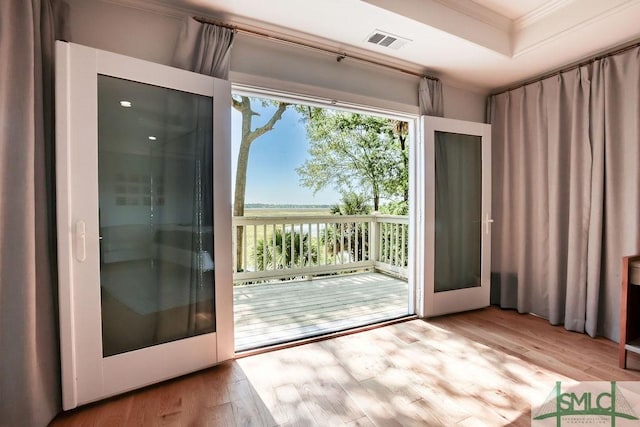 16 Modena Island Dr, Savannah, GA 31411 - doorway to outside with crown molding, wood finished floors, and a water view