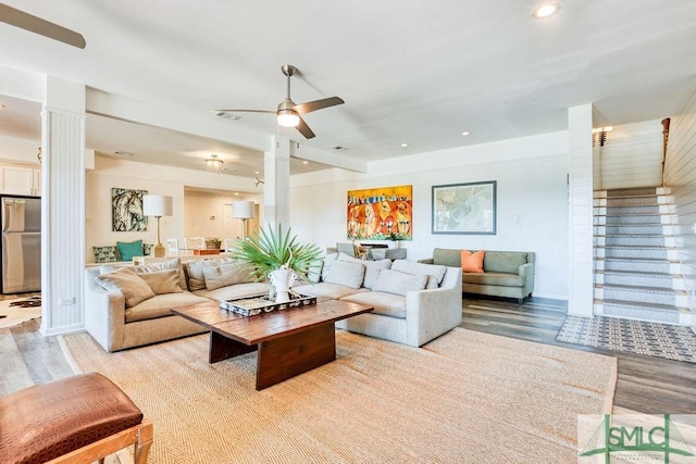 living room with light wood-style floors, ceiling fan, recessed lighting, and decorative columns