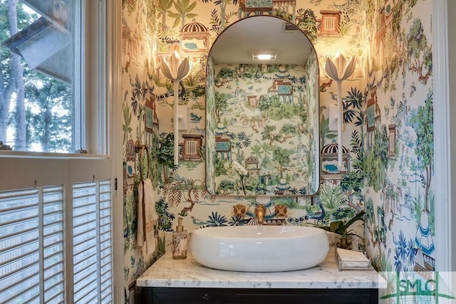 16 Modena Island Dr, Savannah, GA 31411 - bathroom with wallpapered walls, vanity, and plenty of natural light