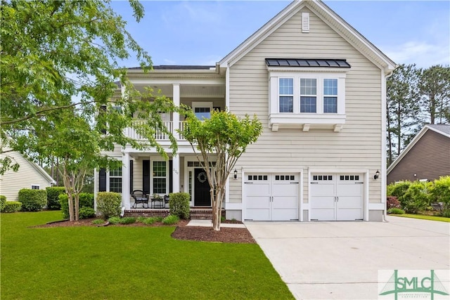 view of front of house with covered porch, a garage, a balcony, a front lawn, and concrete driveway