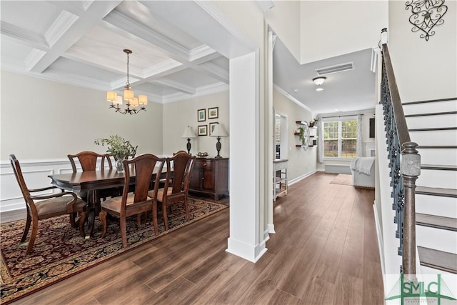 dining room with stairs, beamed ceiling, visible vents, and dark wood-type flooring
