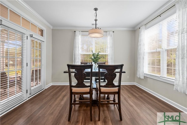 dining space with baseboards, ornamental molding, and dark wood-style flooring