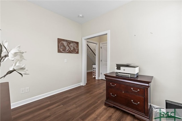 hall with baseboards and dark wood finished floors