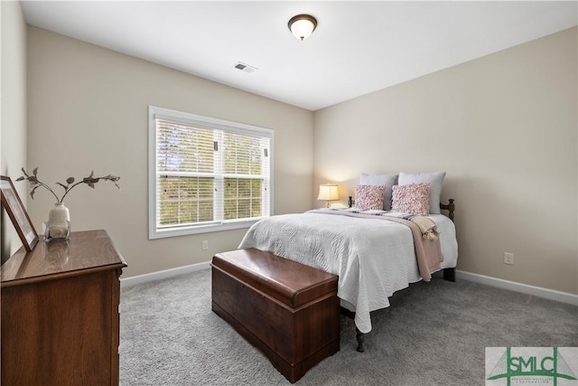 carpeted bedroom with baseboards and visible vents