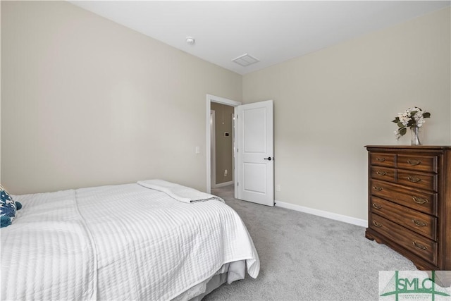 bedroom featuring carpet flooring and baseboards