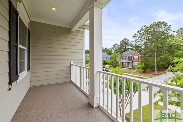balcony featuring a residential view and a porch