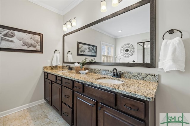 bathroom with baseboards, a sink, and ornamental molding