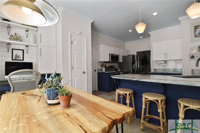 dining space with crown molding and recessed lighting