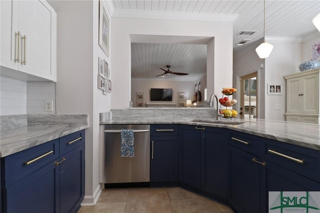 kitchen with a sink, decorative backsplash, light tile patterned floors, stainless steel dishwasher, and blue cabinets