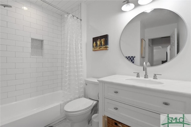full bathroom with vanity, shower / tub combo, and toilet