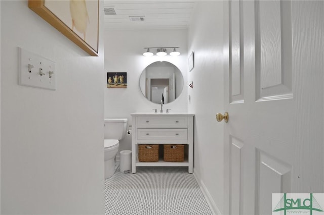 bathroom with vanity, toilet, baseboards, visible vents, and wood ceiling