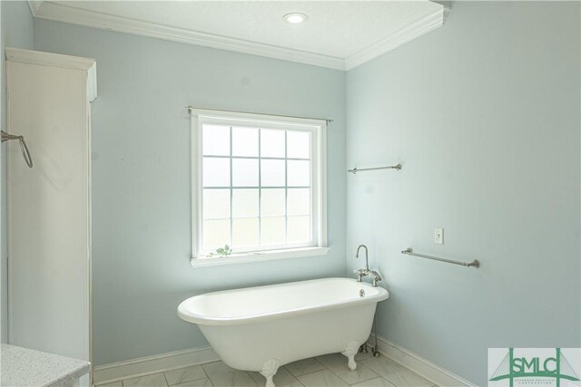 bathroom with ornamental molding, marble finish floor, baseboards, recessed lighting, and a freestanding bath