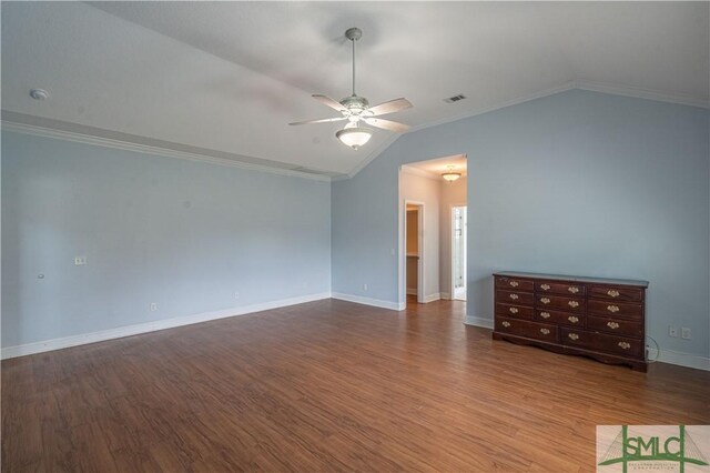 unfurnished room with ornamental molding, a ceiling fan, vaulted ceiling, and wood finished floors