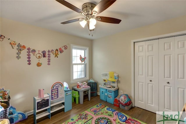 rec room with ceiling fan and wood finished floors