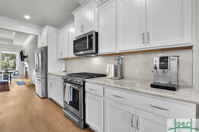 631 Blue Moon Xing, Pooler, GA 31322 - kitchen with decorative backsplash, white cabinetry, appliances with stainless steel finishes, and ornamental molding