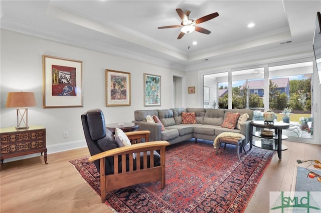 631 Blue Moon Xing, Pooler, GA 31322 - living area with light wood-style flooring, a raised ceiling, ceiling fan, and ornamental molding