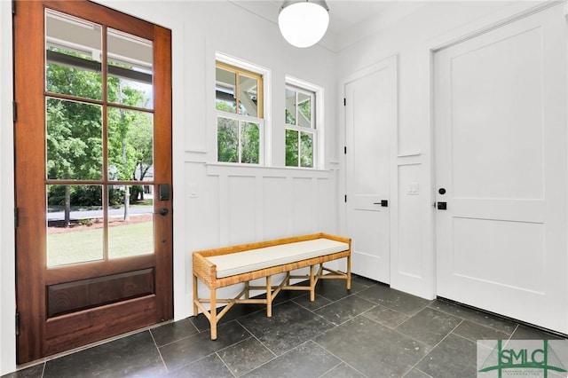 entryway featuring plenty of natural light and a decorative wall