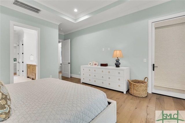bedroom with recessed lighting, visible vents, wood finished floors, and ensuite bathroom