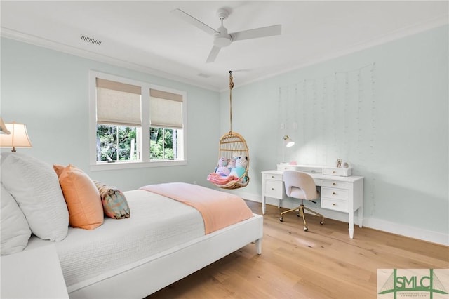 bedroom with baseboards, ceiling fan, light wood finished floors, and visible vents