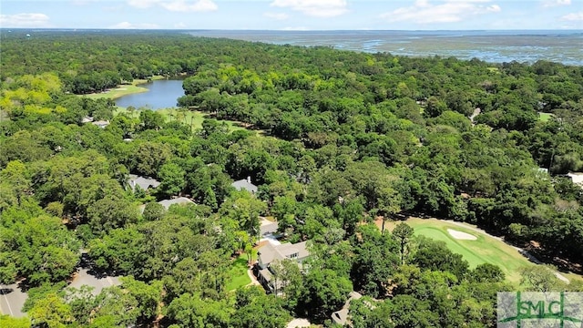 birds eye view of property with a water view, view of golf course, and a wooded view