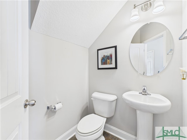 1246 Cypress Fall Cir, Hinesville, GA 31313 - half bath featuring baseboards, toilet, and lofted ceiling