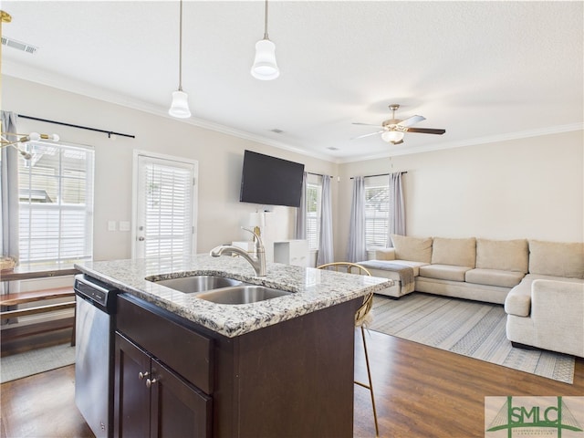 1246 Cypress Fall Cir, Hinesville, GA 31313 - kitchen with stainless steel dishwasher, a sink, wood finished floors, and dark brown cabinetry