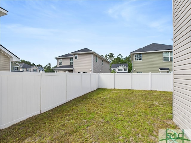 1246 Cypress Fall Cir, Hinesville, GA 31313 - view of yard featuring a fenced backyard and a residential view