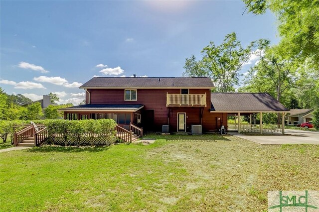 178 Country Way, Springfield, GA 31329 - rear view of house with a yard, a wooden deck, central AC, concrete driveway, and an attached carport