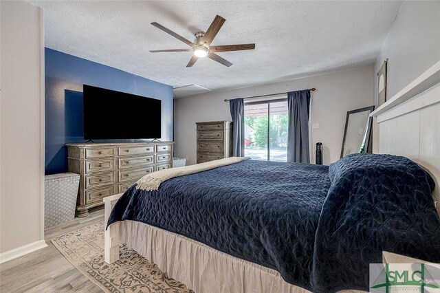 178 Country Way, Springfield, GA 31329 - bedroom with light wood-style floors, a ceiling fan, a textured ceiling, and baseboards