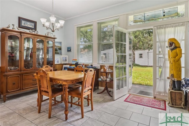 1508 Miller Ave, Tybee Island, GA 31328 - dining room featuring an inviting chandelier and ornamental molding