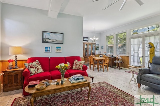 1508 Miller Ave, Tybee Island, GA 31328 - living room featuring light tile patterned floors, crown molding, and wooden walls