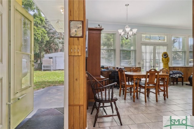 1508 Miller Ave, Tybee Island, GA 31328 - dining space with plenty of natural light, ornamental molding, tile patterned flooring, and a notable chandelier