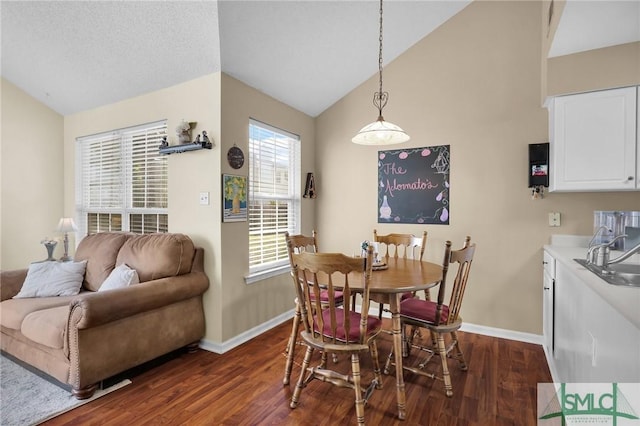 dining space with baseboards, dark wood-style flooring, and vaulted ceiling