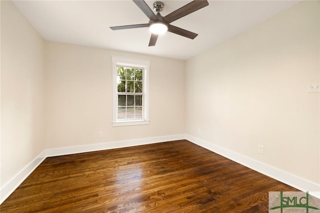 empty room featuring ceiling fan, dark wood-style floors, and baseboards