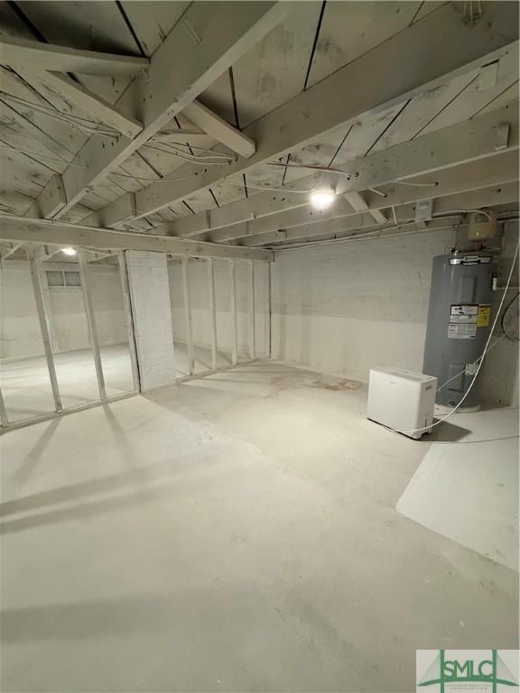 unfinished basement with electric water heater