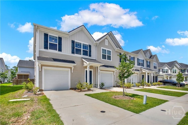 132 Congo Ct, Pooler, GA 31322 - townhome / multi-family property with a garage, board and batten siding, driveway, a residential view, and a front lawn